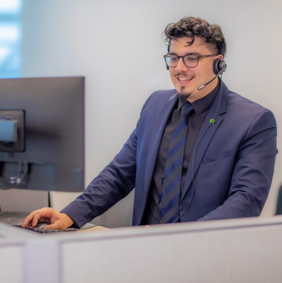 A member of a TD contact centre team smiling.