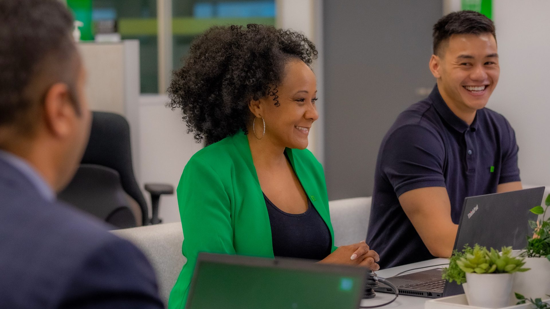 A TD colleague smiles while meeting with a colleague.